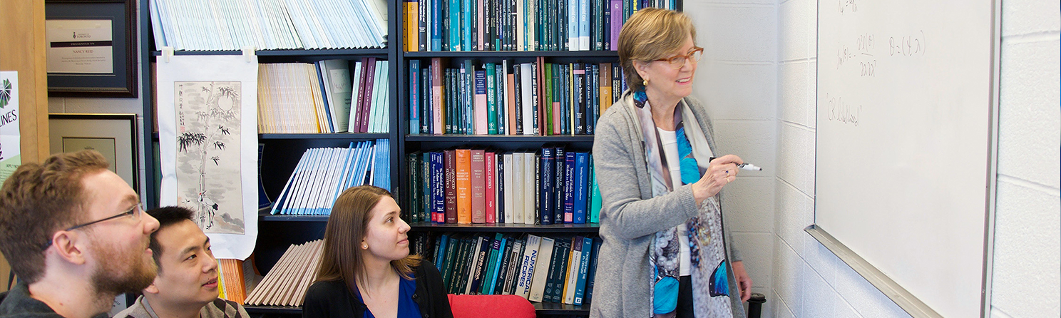 Professor Nancy Reid in conversation with three graduate students