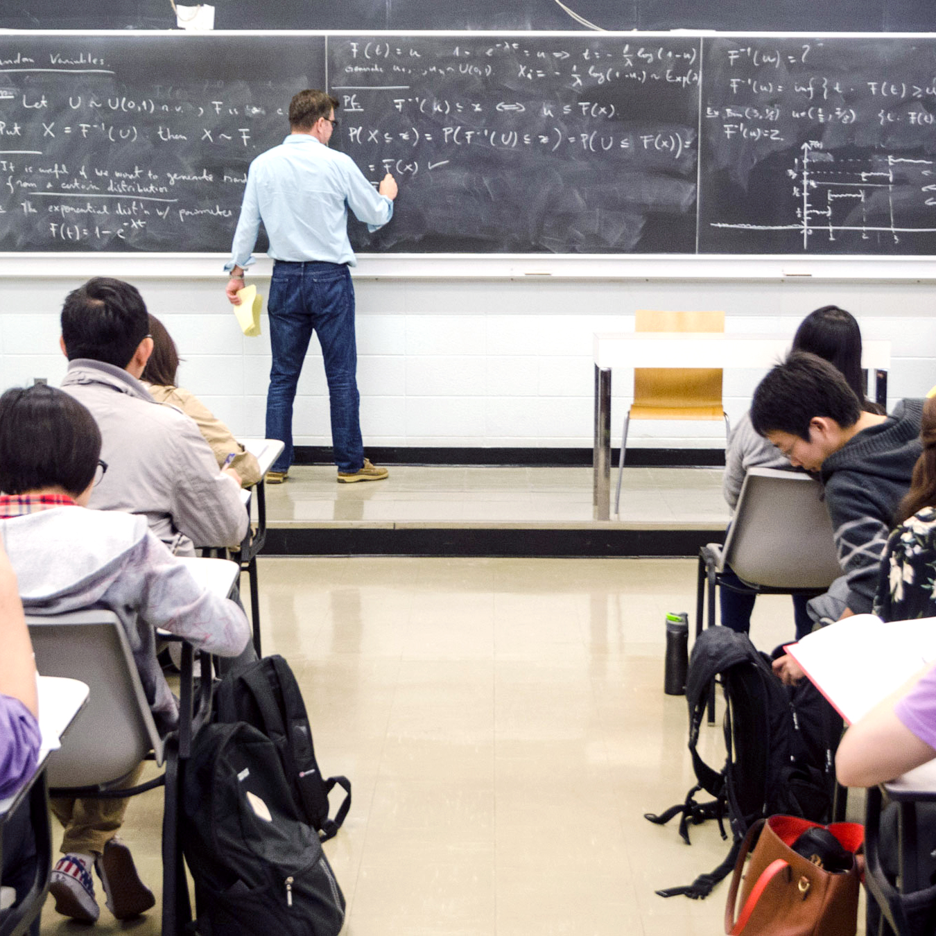 Professor Radu teaching students in classroom setting