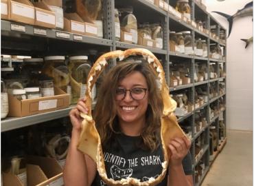 Vianey Leos Barajas holds shark teeth